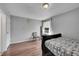 Bright bedroom with wood flooring and a double bed at 2160 S Vaughn Way # 304C, Aurora, CO 80014