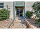 Exterior view of building entrance with stairs and landscaping at 2160 S Vaughn Way # 304C, Aurora, CO 80014