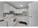 White kitchen with efficient layout and appliances at 2160 S Vaughn Way # 304C, Aurora, CO 80014