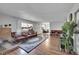 Spacious living room with hardwood floors, fireplace, and ample natural light at 2160 S Vaughn Way # 304C, Aurora, CO 80014