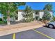 Front view of building with parking and landscaping at 2160 S Vaughn Way # 304C, Aurora, CO 80014