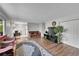 Open living room and dining area with hardwood floors and a view of the kitchen at 2160 S Vaughn Way # 304C, Aurora, CO 80014