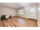 Spacious living room with hardwood floors and large window at 12038 W New Mexico Ave, Lakewood, CO 80228