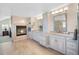 Primary bathroom with double vanity and granite countertops at 42 Tamarade Dr, Littleton, CO 80127