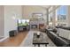 Living room features a stone fireplace and hardwood floors at 42 Tamarade Dr, Littleton, CO 80127