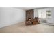Living room featuring a brick fireplace and armchair at 801 N Pennsylvania St # 405, Denver, CO 80203