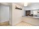 Kitchen area with view to living room and fireplace at 801 N Pennsylvania St # 405, Denver, CO 80203