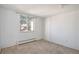 Simple bedroom with neutral walls and carpeting at 801 N Pennsylvania St # 405, Denver, CO 80203