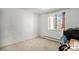 Cozy bedroom with neutral carpeting and a window at 801 N Pennsylvania St # 405, Denver, CO 80203