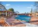 Community pool with a cover on, surrounded by lounge chairs and a clubhouse at 4760 S Wadsworth Blvd # 108, Littleton, CO 80123