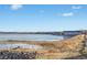 Lake view with a walkway along the shore and buildings in the distance at 4760 S Wadsworth Blvd # 108, Littleton, CO 80123