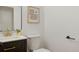 Clean bathroom with dark vanity, updated fixtures, and a modern mirror at 7101 W Yale Ave # 3402, Denver, CO 80227