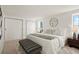 Main bedroom with plush carpet, large window, and ample closet space at 7101 W Yale Ave # 3402, Denver, CO 80227