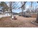 Backyard view with a screened porch, a fire pit, and gravel landscaping at 119 S 8Th Ave, Brighton, CO 80601