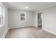 Bright and spacious living room with new flooring and fresh paint at 4835 Shoshone St, Denver, CO 80221