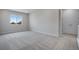 Spacious bedroom with carpeted floors and large window at 3442 N Gold Bug Ct, Aurora, CO 80019