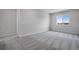 Bright and airy bedroom with carpeted floors and window at 3442 N Gold Bug Ct, Aurora, CO 80019