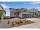Two-story house with two-car garage and landscaped front yard at 3442 N Gold Bug Ct, Aurora, CO 80019