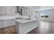 Modern kitchen with island and stainless steel appliances at 3442 N Gold Bug Ct, Aurora, CO 80019