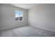 Bright bedroom with window and neutral carpet at 3442 N Gold Bug Ct, Aurora, CO 80019