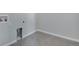 Bright laundry room with tile floor and built-in shelving at 3442 N Gold Bug Ct, Aurora, CO 80019