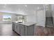 Modern kitchen with island and stainless steel appliances at 3442 N Gold Bug Ct, Aurora, CO 80019