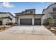 Two-story house with two-car garage and landscaped front yard at 3442 N Gold Bug Ct, Aurora, CO 80019