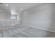 Spacious loft area with carpeted floors and multiple windows at 3442 N Gold Bug Ct, Aurora, CO 80019