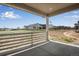 Covered patio with a view of neighboring houses and open space at 3442 N Gold Bug Ct, Aurora, CO 80019