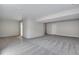 Large unfinished basement area with grey carpeting at 3442 N Gold Bug Ct, Aurora, CO 80019