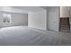 Spacious unfinished basement with neutral carpeting and large window at 3442 N Gold Bug Ct, Aurora, CO 80019