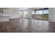 Open concept living room with hardwood floors and patio access at 3442 N Gold Bug Ct, Aurora, CO 80019