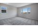 Comfortable bedroom with carpeted floors and a window with a view at 3442 N Gold Bug Ct, Aurora, CO 80019