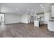 Bright and airy living room, open to kitchen and dining area at 3442 N Gold Bug Ct, Aurora, CO 80019