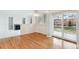 Dining area with hardwood floors, fireplace, and access to backyard at 8154 Lone Maple Ln, Lone Tree, CO 80124