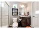 Clean bathroom with shower, granite vanity, and updated fixtures at 21803 E 46Th Ave, Aurora, CO 80019