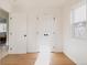 Bright bedroom with hardwood floors and double doors at 1446 W Nevada Pl, Denver, CO 80223