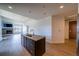 Modern kitchen with island, stainless steel appliances, and open floor plan at 3301 Arapahoe Ave # 214, Boulder, CO 80303