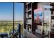 Home office with a media center and stunning city views from the window at 1650 Fillmore St # 2107, Denver, CO 80206