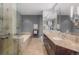 Spa-like bathroom with double vanity and soaking tub at 1650 Fillmore St # 2107, Denver, CO 80206