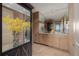 Elegant bathroom with granite countertops and mirrored cabinets at 1650 Fillmore St # 2107, Denver, CO 80206