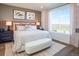 Spacious main bedroom with large window and neutral decor at 9274 Biscay St, Commerce City, CO 80022