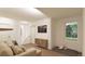 Bright basement Gathering room with sectional sofa and large window at , Aurora, CO 80019