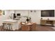 Modern kitchen with island, white cabinets, and stainless steel appliances at , Aurora, CO 80019