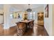 Rustic dining room with hardwood floors and a wooden table at 14969 Elsinore Ave, Parker, CO 80134