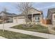 Two-story house with neutral siding, stone accents, and a two-car garage at 14969 Elsinore Ave, Parker, CO 80134