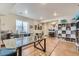 Finished basement office space with a large glass desk and ample shelving at 14969 Elsinore Ave, Parker, CO 80134