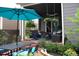 Relaxing covered patio with outdoor furniture and lush greenery at 14969 Elsinore Ave, Parker, CO 80134