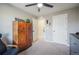 Cozy bedroom featuring a wooden cabinet and a comfortable armchair at 15946 Little Bluestem Rd, Monument, CO 80132