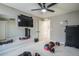 Home gym with a large TV, mirrors, and fitness equipment at 15946 Little Bluestem Rd, Monument, CO 80132